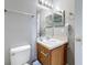 Bathroom with a vanity, toilet, and essential accessories at 2634 Andros Ln, Kissimmee, FL 34747