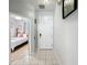 Tiled hallway with views into the bedroom at 2634 Andros Ln, Kissimmee, FL 34747