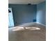 Cozy living room with a blue painted wall, simple and comfortable living space at 3695 Dale Ct, Mount Dora, FL 32757