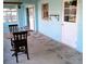 Enclosed patio with a table and chairs, offering a versatile space for dining and relaxation at 3695 Dale Ct, Mount Dora, FL 32757