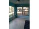 Bright sunroom with large windows and ceiling fan, offering ample natural light and ventilation at 3695 Dale Ct, Mount Dora, FL 32757
