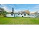 Spacious backyard featuring a shed, providing ample storage and outdoor potential at 101 Ellison Ave, New Smyrna Beach, FL 32168
