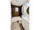Updated bathroom with modern vanity, updated floors, and shower-tub combo at 101 Ellison Ave, New Smyrna Beach, FL 32168