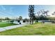 Inviting one-story home featuring well-maintained landscaping and a charming covered entryway at 101 Ellison Ave, New Smyrna Beach, FL 32168