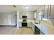 Modern kitchen with stainless appliances, sleek countertops, and ample cabinet space at 101 Ellison Ave, New Smyrna Beach, FL 32168