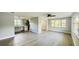 Open-concept living area showcasing the modern flooring and connecting the living spaces at 101 Ellison Ave, New Smyrna Beach, FL 32168
