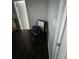 Corner of bedroom featuring dark wood floors, neutral walls, and a chair at 2822 Seymore St, Lakeland, FL 33813