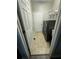 Laundry room featuring a side-by-side washer and dryer set with white shelving at 2822 Seymore St, Lakeland, FL 33813