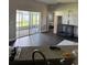 Cozy living room with sliding glass doors and views to screened patio at 2822 Seymore St, Lakeland, FL 33813