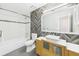 Updated bathroom featuring modern tile work, stylish vanity, and a shower-tub combination at 1776 E Cheryl Dr, Winter Park, FL 32792