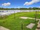 Lush backyard with serene lake views and greenery at 318 Mitnik Dr, Deltona, FL 32738