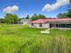 View of the home's backyard and the neighboring home at 318 Mitnik Dr, Deltona, FL 32738