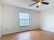Bright bedroom with a large window showcasing a scenic lake view at 318 Mitnik Dr, Deltona, FL 32738