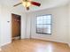 Bedroom features wood-look floors and a closet, with a large window at 318 Mitnik Dr, Deltona, FL 32738