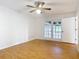 Bright bedroom with wood floor and sliding doors to the backyard at 318 Mitnik Dr, Deltona, FL 32738