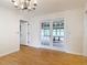 Dining room with wood-look floors, a chandelier, and french doors at 318 Mitnik Dr, Deltona, FL 32738