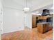 Traditional kitchen with wooden cabinets, a granite island, and black appliances, creating a functional space at 318 Mitnik Dr, Deltona, FL 32738