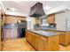 Well-equipped kitchen featuring granite countertops, tile floors, and ample cabinet space at 318 Mitnik Dr, Deltona, FL 32738