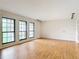 Bright living room with wood-look floors, track lighting, and large windows at 318 Mitnik Dr, Deltona, FL 32738