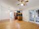 Open living space with a view of the kitchen and sliding glass doors, creating a seamless flow for modern living at 318 Mitnik Dr, Deltona, FL 32738