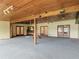 Spacious covered patio with wood ceilings and french doors leading to the backyard at 318 Mitnik Dr, Deltona, FL 32738