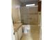 Full bathroom with tiled floors, a shower-tub combo, and a framed shower door at 910 Orchid St, Lady Lake, FL 32159