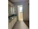 Bathroom with a vanity with a sink and a doorway to a separate room at 910 Orchid St, Lady Lake, FL 32159