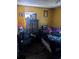 Bedroom with yellow walls, a closet, and a single bed at 5195 Edwina St, Orlando, FL 32811