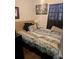 Cozy bedroom featuring a queen-sized bed and a window at 5195 Edwina St, Orlando, FL 32811