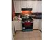 Kitchen area with white cabinets, a gas oven and tile floor at 5195 Edwina St, Orlando, FL 32811