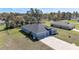 A beautiful aerial view of a single-Gathering home showcasing a spacious yard and long driveway at 11331 Sw 54Th Cir, Ocala, FL 34476
