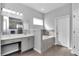 Elegant bathroom featuring a tub, a vanity with countertop space, and modern fixtures at 11331 Sw 54Th Cir, Ocala, FL 34476