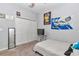 Cozy bedroom featuring a closet, neutral carpet, ceiling fan, and decoratively adorned walls at 11331 Sw 54Th Cir, Ocala, FL 34476
