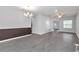 Open-concept dining room with modern lighting, hardwood floors, and a view of the living area, great for entertaining at 11331 Sw 54Th Cir, Ocala, FL 34476