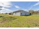 Exterior side view of house with a fenced backyard, showing a neighboring house at 11331 Sw 54Th Cir, Ocala, FL 34476