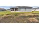 Exterior view of home with screened-in lanai and fenced backyard at 11331 Sw 54Th Cir, Ocala, FL 34476
