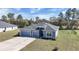 Charming single-story home featuring a three-car garage, well-maintained lawn, and mature trees in a tranquil setting at 11331 Sw 54Th Cir, Ocala, FL 34476
