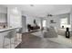 Bright living room featuring modern furniture, stylish decor, hardwood floors, and plenty of natural light from the windows at 11331 Sw 54Th Cir, Ocala, FL 34476