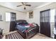 Simple bedroom featuring a comfortable bed, neutral wall paint, and tile flooring at 1222 Avenue M, Haines City, FL 33844