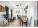 Simple dining room with tile floors, with a mix of chairs and basic furnishings at 1222 Avenue M, Haines City, FL 33844