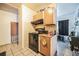 Functional kitchen with basic appliances, ample cabinet space, and neutral tile flooring at 1222 Avenue M, Haines City, FL 33844