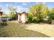 Shed on a grassy lot with trees in the background at 1222 Avenue M, Haines City, FL 33844