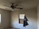 Bedroom with peeling paint, damaged ceiling and boarded up windows at 1075 Merritt St, Altamonte Springs, FL 32701