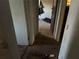 Hallway with debris and trash on the floor and damaged walls at 1075 Merritt St, Altamonte Springs, FL 32701
