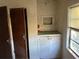 View of small room with dated finishes and including a fire extinguisher at 1075 Merritt St, Altamonte Springs, FL 32701