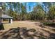A large, empty backyard offering plenty of room for outdoor activities at 5593 Sw 199Th Ct, Dunnellon, FL 34431