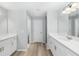 Elegant bathroom featuring dual sinks, granite countertops, and modern fixtures at 5593 Sw 199Th Ct, Dunnellon, FL 34431