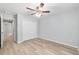 Well-lit bedroom with closet, light wood floors, and neutral walls offering a calm and inviting space at 5593 Sw 199Th Ct, Dunnellon, FL 34431