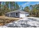 Well-maintained home with an attached garage and nicely manicured landscaping at 5593 Sw 199Th Ct, Dunnellon, FL 34431