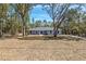 Charming single-story home featuring a landscaped lawn and a welcoming front entrance at 5593 Sw 199Th Ct, Dunnellon, FL 34431